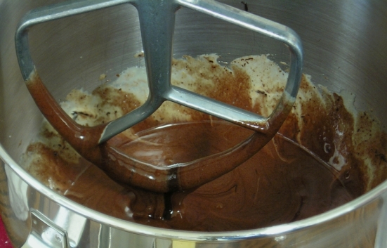 Making the cake layer: chocolate mixture being added to the eggs and sugar.