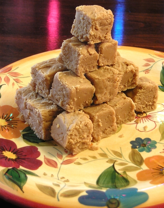 Peanut Butter Fudge, with lights from the Yule tree reflected against the table.